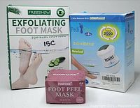 Photo of the foot care bundle boxes including Freeshow exfoliating foot mask, Pedi Vac callus remover, and Pinopex foot peel mask.