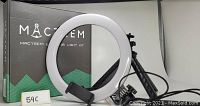 Photo showing the Mactrem LED ring light, the box, and tripod stand.