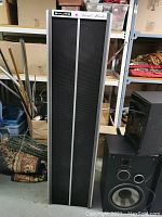 Full height view of the Shure Vocal Master VA300-S speaker with black grille and silver trim.