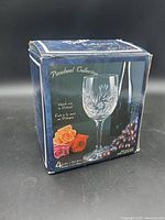 Box showing Brilliant Pinwheel Collection branding, box design, and indication of hand cut in Poland for 4 wine glasses