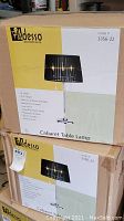 Box showing Adesso brand and Cabaret Table Lamp label with features and model number 3356-22.