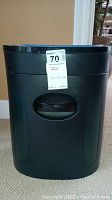 Front view of black Royal paper shredder with a white MaxSold price tag attached.