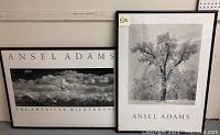 Two framed Ansel Adams black and white photographs side by side; one shows mountain wilderness, the other a large tree covered in frost
