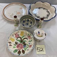 Top view of all ceramic items showing the majolica plate, Quimper covered dish, Boleslawiec bowls, Ardis Japan platter, and salt and pepper shakers