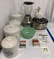 Full set of kitchenware items including mixer, blender, spice cans, vintage jadeite bowl, and spice boxes