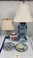 View showing both porcelain lamps, ginger jar, and three bowls with various patterns