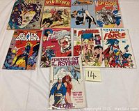 Photo showing the set of 9 vintage comic books arranged side by side.