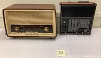 Two radios side by side on table: left BLAUPUNKT table radio, right Soviet portable; both visible