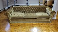 Full front view of the crushed velvet retro sofa showing three seat cushions and tufted backrest with diamond pattern