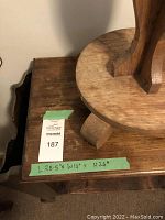 Close-up photo showing wood grain, condition, and dimensions (L 28.5" x W 14" x H 26") of the magazine rack side table's top surface.