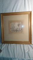 Full view of framed pencil sketch with mat and frame
