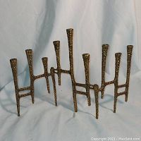 Full view of the menorah fully extended on white background