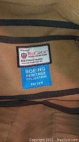 Close-up photo of inside label showing Red Canoe branding and Boeing Heritage Collection tag.