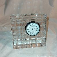 Front view of rectangular Waterford crystal desktop clock displaying the clock face with Roman numerals and Waterford branding.