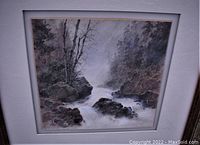 Front view of signed watercolor landscape painting depicting rocks and trees with flowing water in muted colors, mounted in white mat.