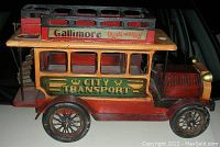 Front and side view showing City Transport signage and spoked wheel detail