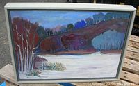Framed oil painting of a winter landscape titled "Frozen Lake", signed by artist Lynn Mallin. Scene includes frozen lake, bare trees, hills with purple and blue tones.