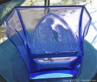 Front and side views of the purple frosted Bohemian glass bowl with etched nativity scene showing figures of Mary, Joseph, and baby Jesus.
