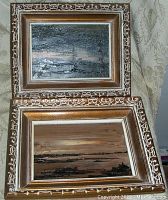 Two framed oil paintings by Claire Desrosiers stacked against each other, showing overall condition and frame detail.
