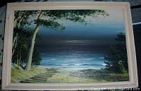 Full front view of painting and white wood frame