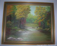 Frontal view of the framed oil painting showing the full artwork and wood frame with gold trim.