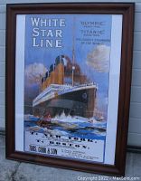 Framed advertisement poster for White Star Line ships Olympic and Titanic with wooden frame and white mat border.