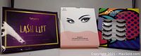 Photo of three boxed eyelash kits: Tetyana Lash Lift kit, magnetic eyelashes and eyeliner set, and false eyelash adhesive set.