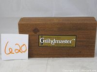 Closed wooden box with Grandmaster label on top