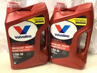Two red 10L containers of Valvoline Synthetic Blend High Mileage MaxLife motor oil, SAE 5W-30, side by side showing the front label.