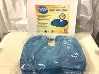 Forsite Memory Foam Seat Cushion in original packaging, blue cushion visible.