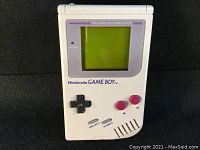 Front view of Nintendo GAME BOY handheld showing screen, buttons, and casing condition.