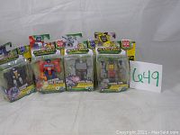 All four Transformers Cyberverse Adventures action figures in damaged but intact packaging: Ramjet, Optimus Prime, Megatron, Grimlock.