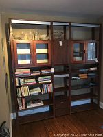 Full view of assembled shelving system with glassware and books