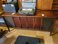 Full front view of the Victrola RCA Victor wooden console with speaker grills and paneling.