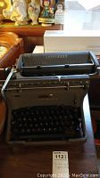 Full view of vintage Underwood typewriter showing the entire unit including the carriage and keyboard.