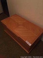 Closed chest showing patterned top and front edge handle