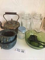 Shows full lot including brass kettle, copper pot, green salad bowl with tongs, and glass jars.