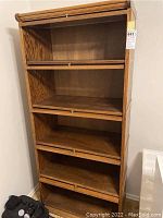 Full view of the barrister bookcase showing stacked glass front shelved compartments and finish.