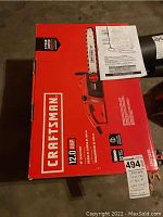 Photo of the boxed Craftsman electric chainsaw showing the brand logo, motor amp rating (12.0 Amp), and bar size (16 inch).