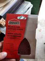 JOBMATE brand hook and loop sanding sheets in red packaging, designed for detail sander usage