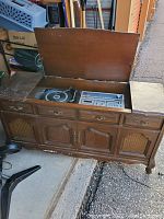 View from the side of the open console showing the size and placement of audio components inside.