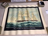 Framed print showing a detailed sailing ship titled "Westward Ho" on ocean waves with artist signature.