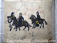 Full view of the batik painting showing three women on horses with traditional style and coloration on crackled fabric.