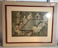 Full view of the framed photographic reproduction featuring Japanese ladies eating, with cream colored frame and red accent matting.