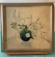 Full view of framed still life flower painting with blue vase and white blossoms