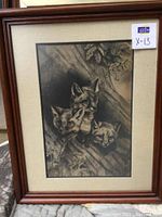 Framed pencil sketch of fox family in natural setting, showing entire frame and label