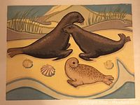 Full view of the seals print showing three seals on a beach setting with shells and water, signed by Muriel Hannah.
