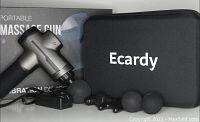 Photo showing Ecardy massage gun, four massage heads, power adapter, and black carrying case with Ecardy logo on box background.