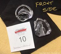 Front side view of dolphin and penguin crystal sculptures with MaxSold lot tag number 10