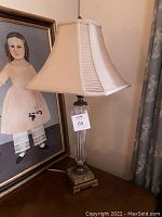 Full front view of lamp showing shade and base